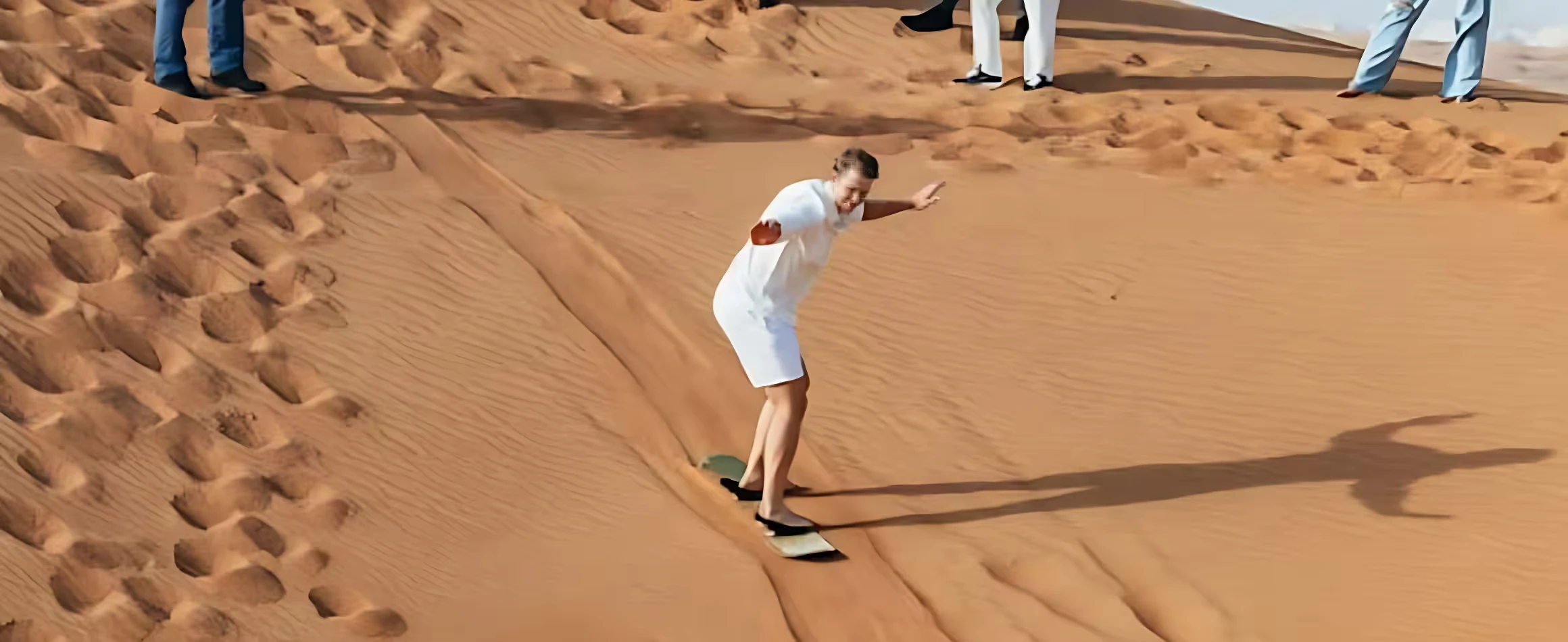 sandboarding in over night desert safari dubai