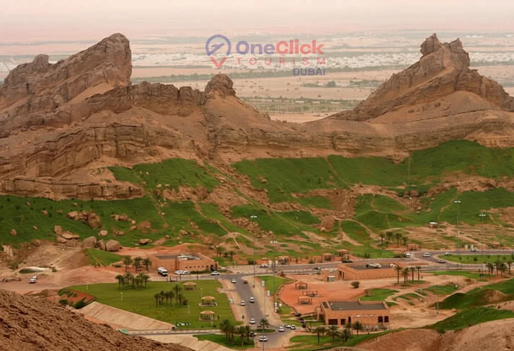 Aerial view of the lush Green Mubazzarah park at the base of Jebel Hafeet mountain in Al Ain.