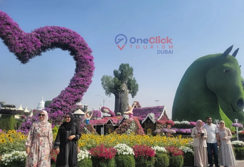 Giant green horse sculpture and purple floral heart arch at Dubai Miracle Garden.